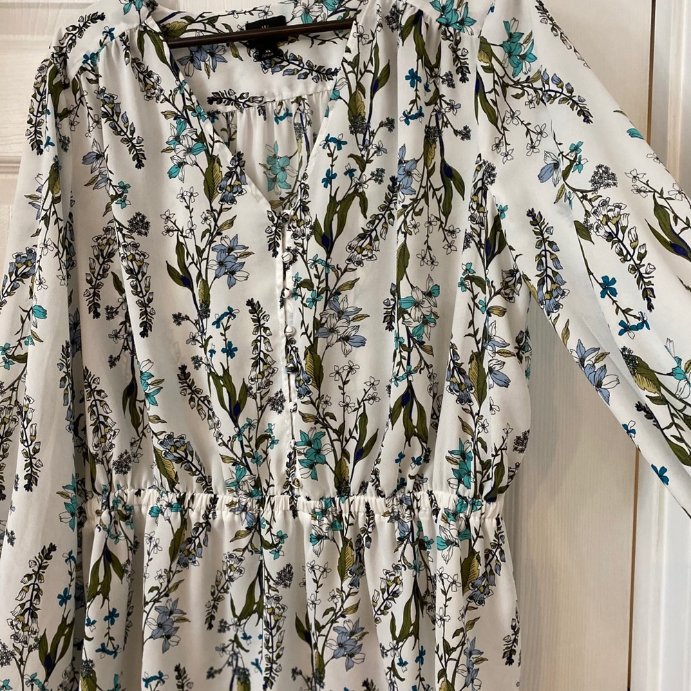 Long sleeve floral blouse.